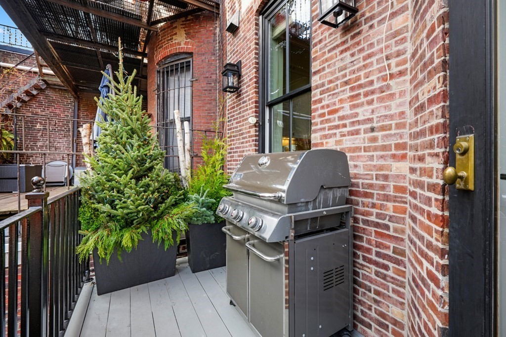 9 Columbus Square, Unit 2 Boston, MA 02116 - Photo 14 of 42 a front view of a house with a yard