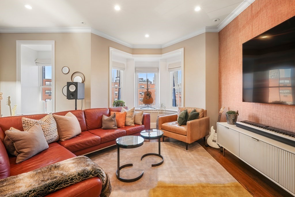 9 Columbus Square, Unit 2 Boston, MA 02116 - Photo 16 of 42 a living room with furniture and a flat screen tv