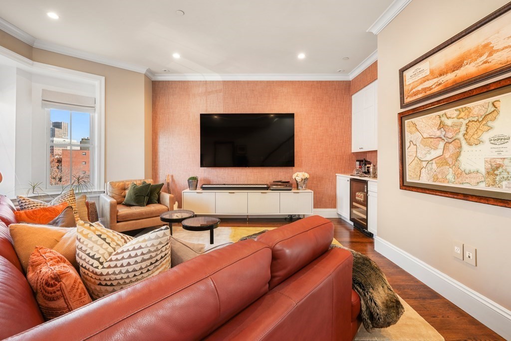 9 Columbus Square, Unit 2 Boston, MA 02116 - Photo 17 of 42 a living room with furniture and a flat screen tv