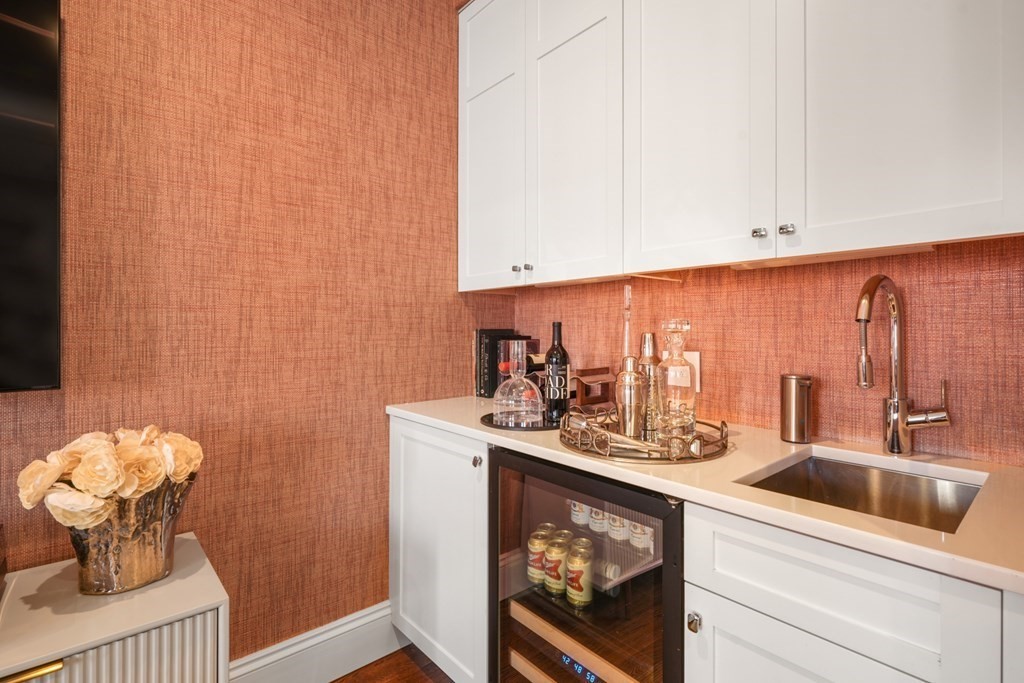 9 Columbus Square, Unit 2 Boston, MA 02116 - Photo 18 of 42 a bathroom with a sink a toilet and mirror