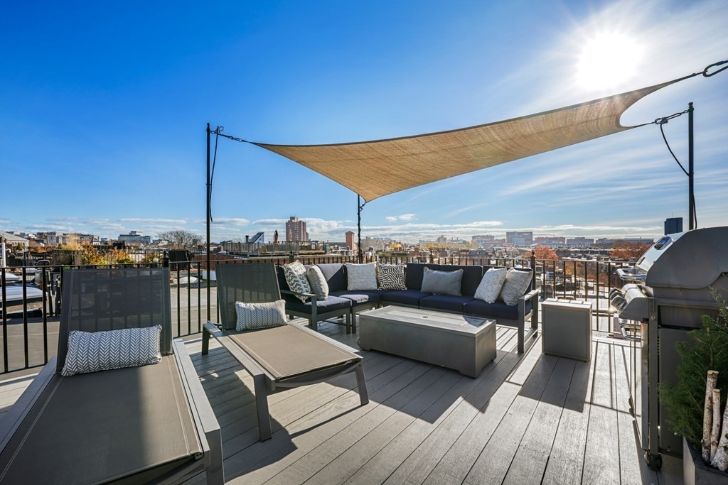 9 Columbus Square, Unit 2 Boston, MA 02116 - Photo 20 of 42 a view of a terrace with couches and city view