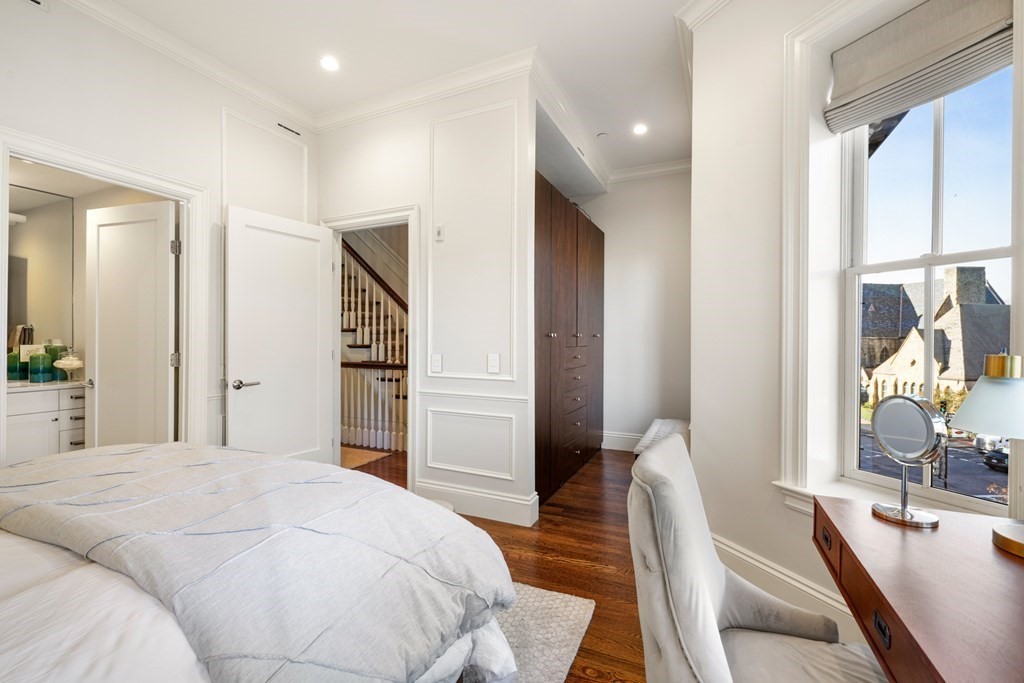 9 Columbus Square, Unit 2 Boston, MA 02116 - Photo 33 of 42 a bedroom with a bed flat screen tv and couches