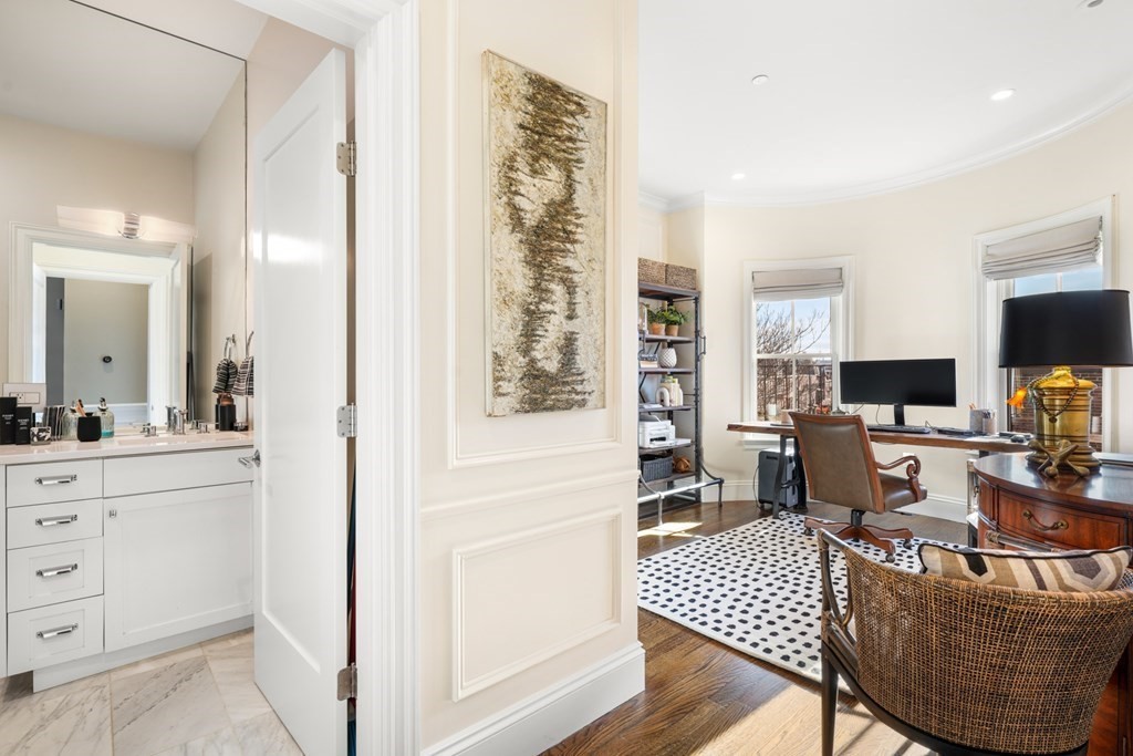 9 Columbus Square, Unit 2 Boston, MA 02116 - Photo 37 of 42 a living room with furniture a flat screen tv and a window