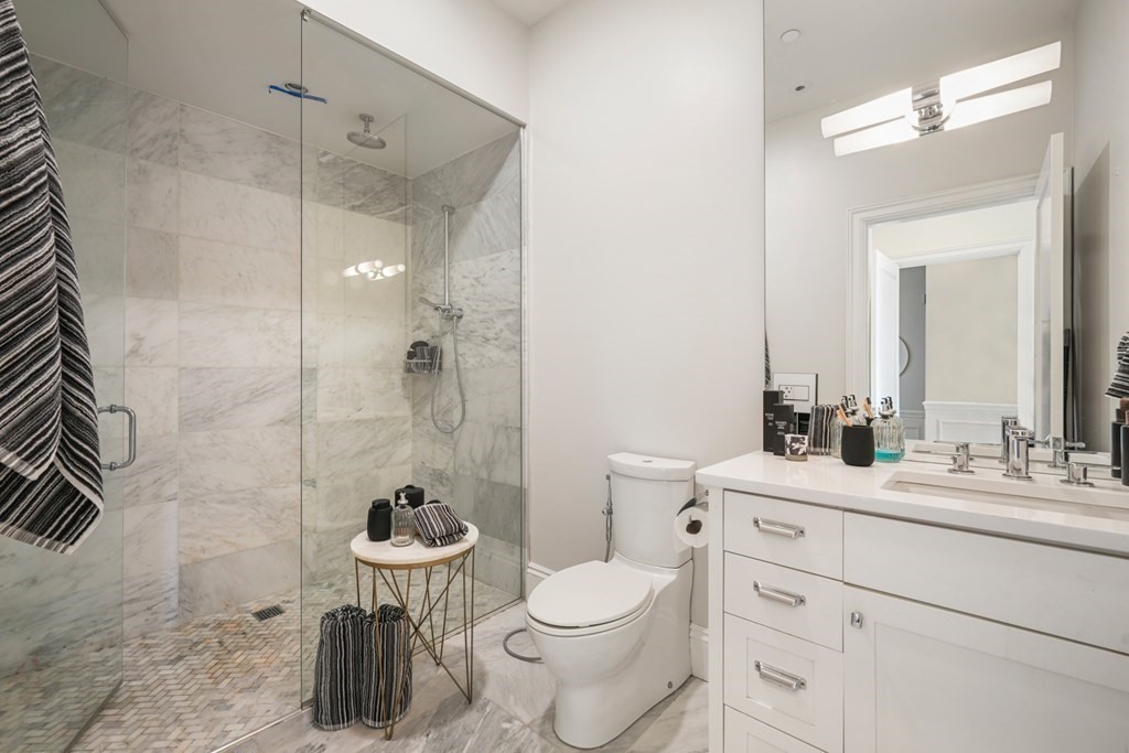 9 Columbus Square, Unit 2 Boston, MA 02116 - Photo 38 of 42 a bathroom with a sink toilet and shower