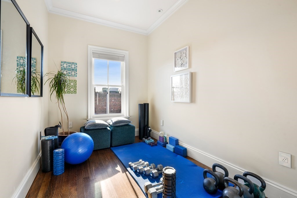 9 Columbus Square, Unit 2 Boston, MA 02116 - Photo 39 of 42 a room with furniture and wooden floor