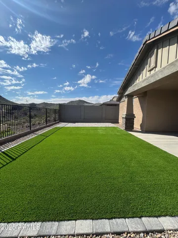 a view of yard with swimming pool and green space
