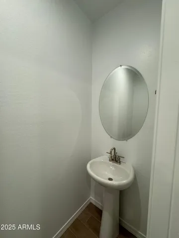 a bathroom with a sink and mirror
