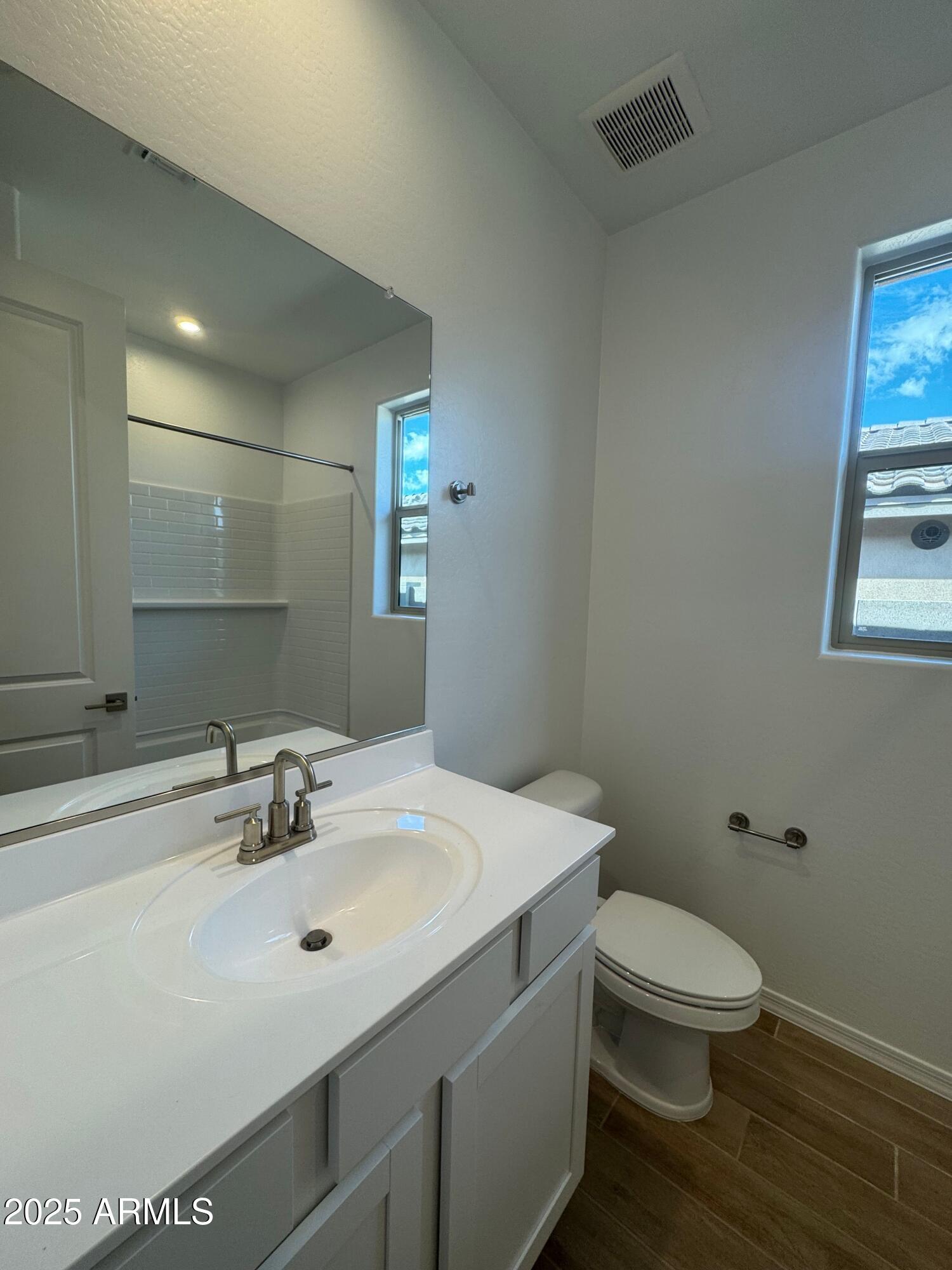 13351 West Eagle Feather Road Peoria, AZ 85383 - Photo 21 of 23 a bathroom with a sink toilet and mirror