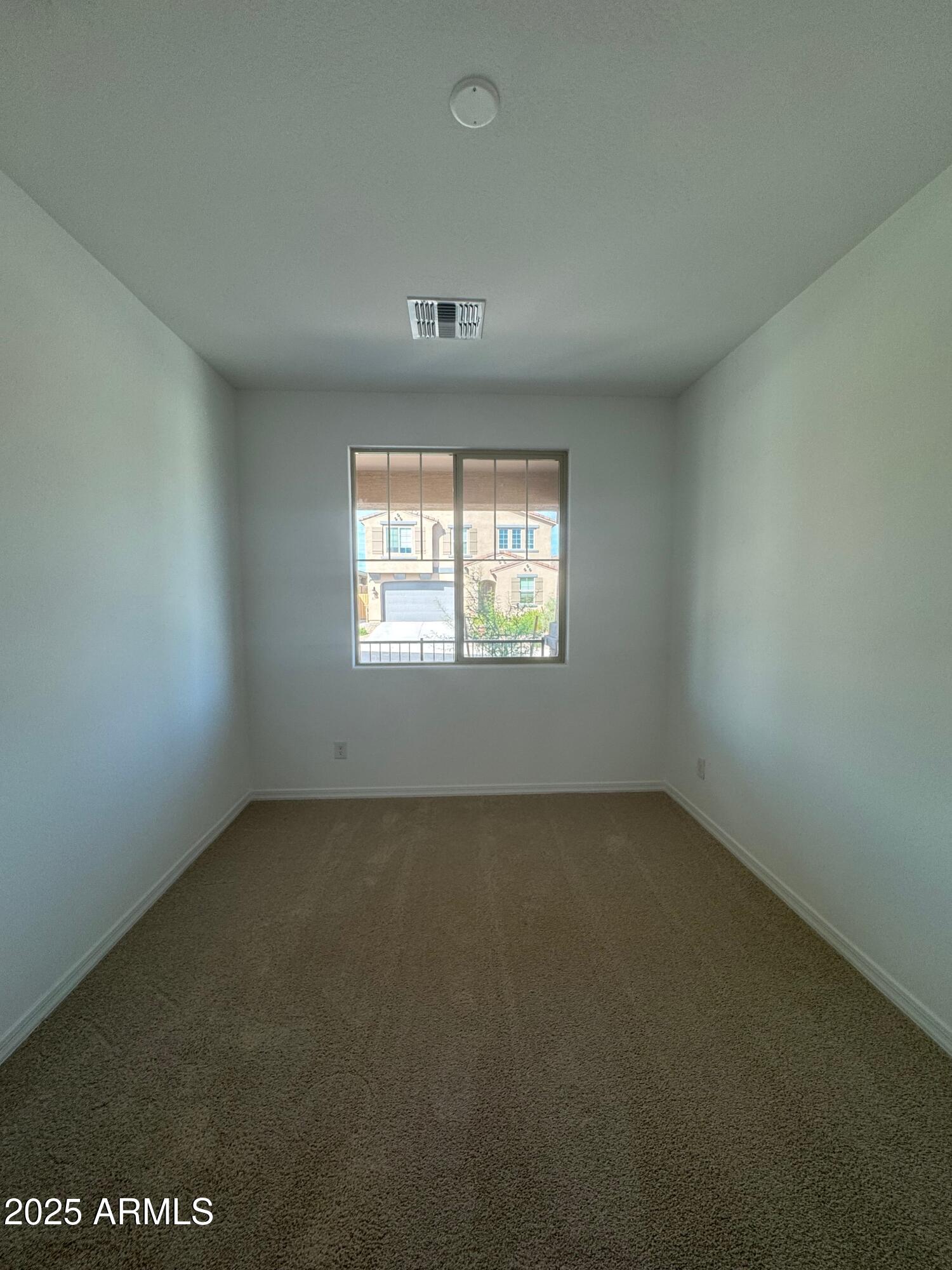 13351 West Eagle Feather Road Peoria, AZ 85383 - Photo 22 of 23 an empty room with a window