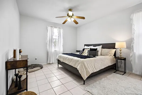 a kitchen with stainless steel appliances granite countertop a stove a sink dishwasher and cabinets with wooden floor