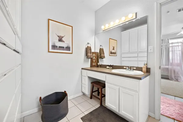 a bed room with a bed and a chair