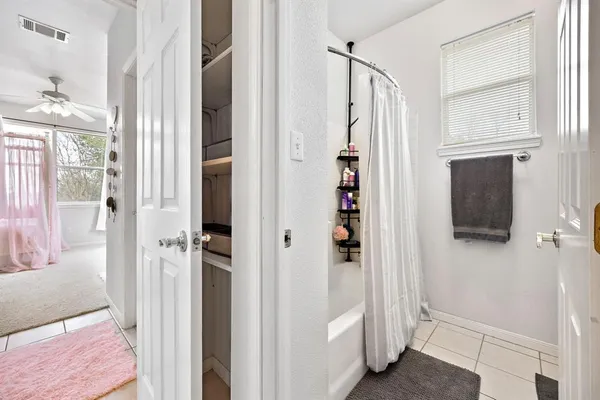 a kitchen with stainless steel appliances granite countertop a stove and a white refrigerator