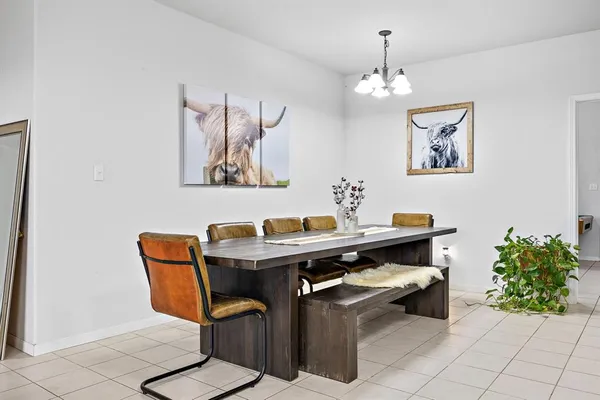 a kitchen with a sink a stove and a refrigerator