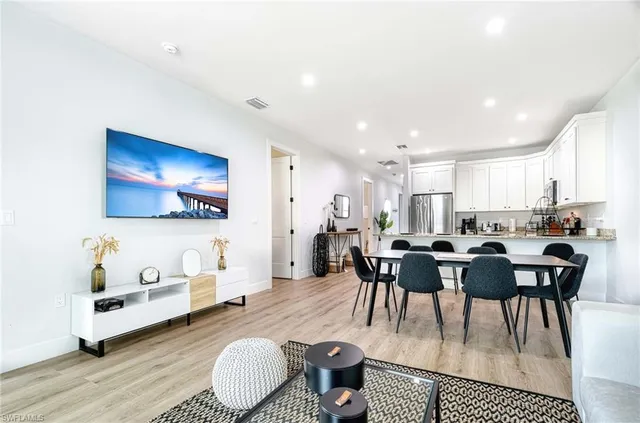 a view of a dining room with furniture and wooden floor