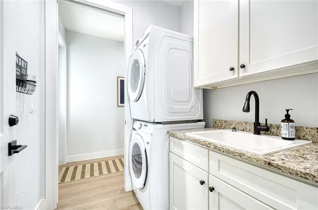 a bathroom with a sink and a washing machine