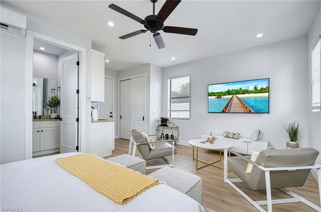 a bedroom with a bed and a couch