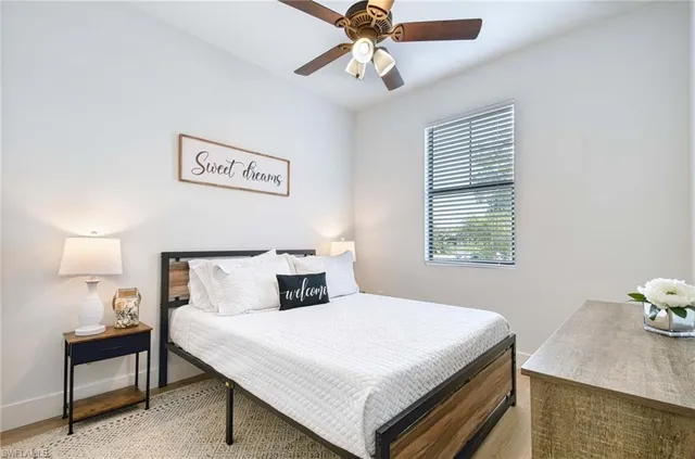 a bedroom with a bed and a table