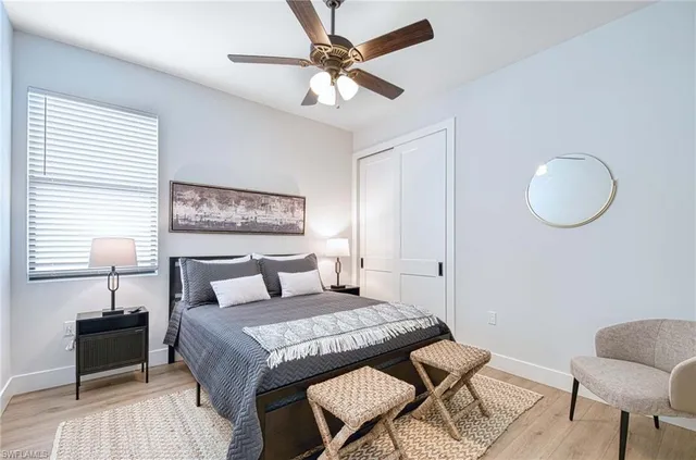 a living room with furniture and a lamp