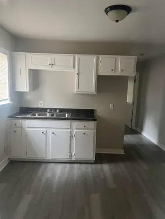 a kitchen with a sink and cabinets