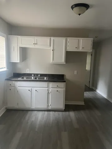 a kitchen with a sink and cabinets