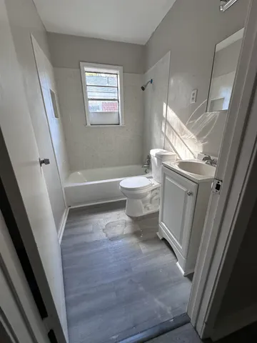 a bathroom with a sink a toilet and a bathtub