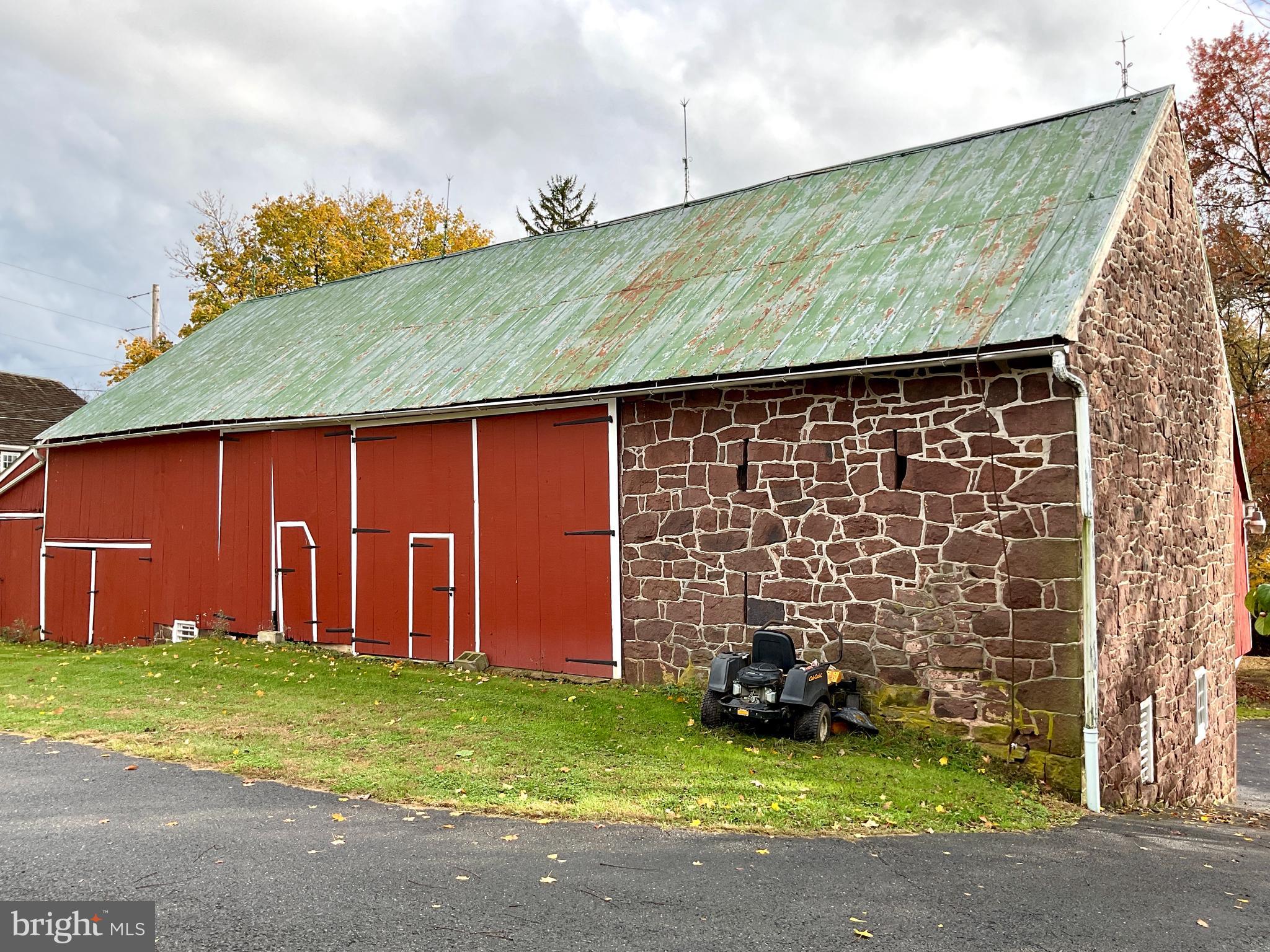 1145 Reading Road Narvon, PA 17555 - Photo 15 of 62 a backyard of a house with barbeque oven and garden