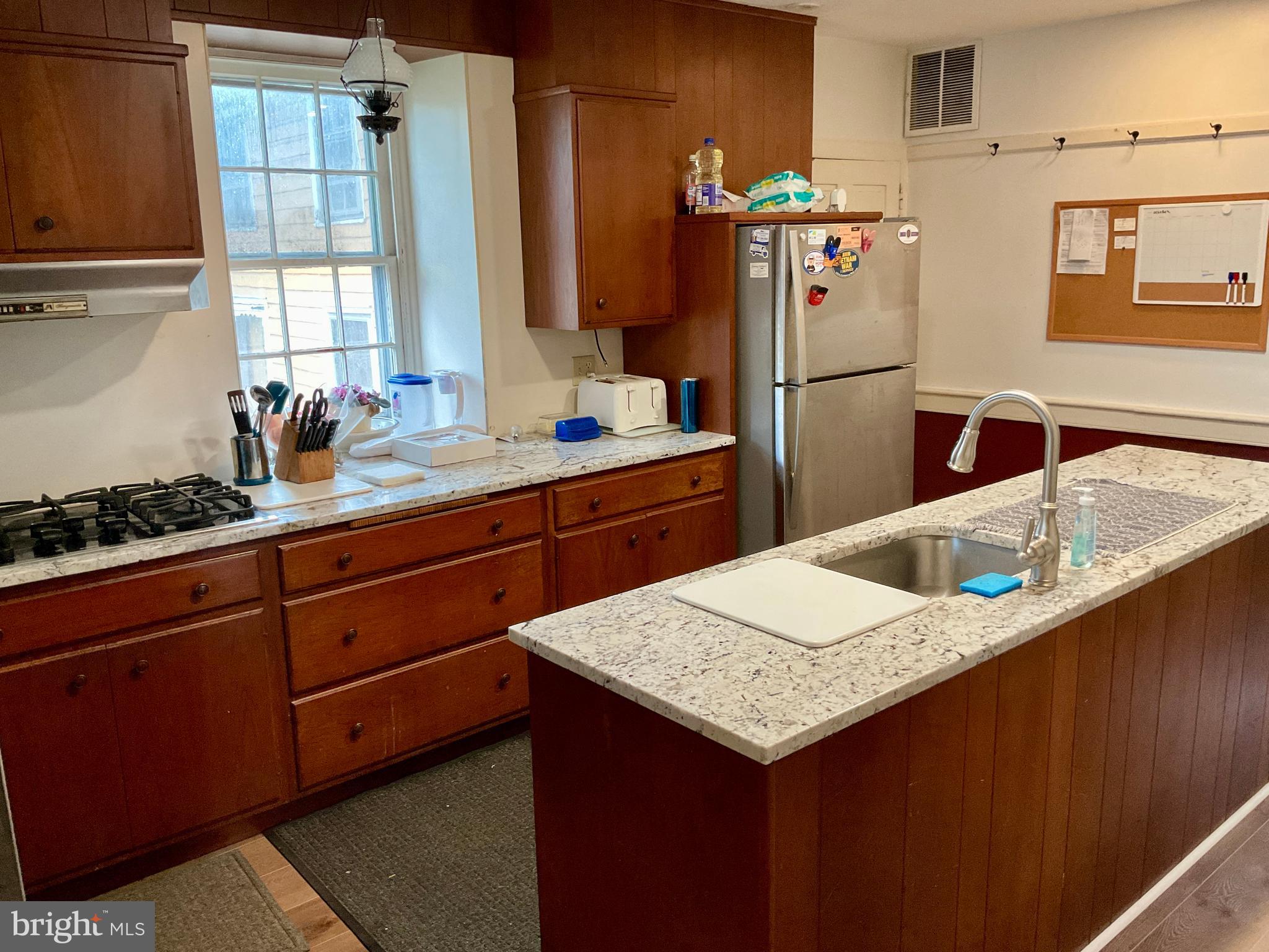 1145 Reading Road Narvon, PA 17555 - Photo 46 of 62 a kitchen with granite countertop a sink stove and refrigerator