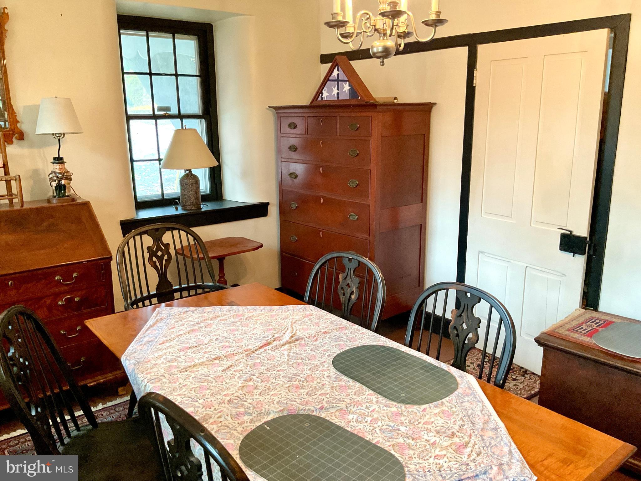 1145 Reading Road Narvon, PA 17555 - Photo 48 of 62 a bedroom with a bed a dresser a mirror and a window