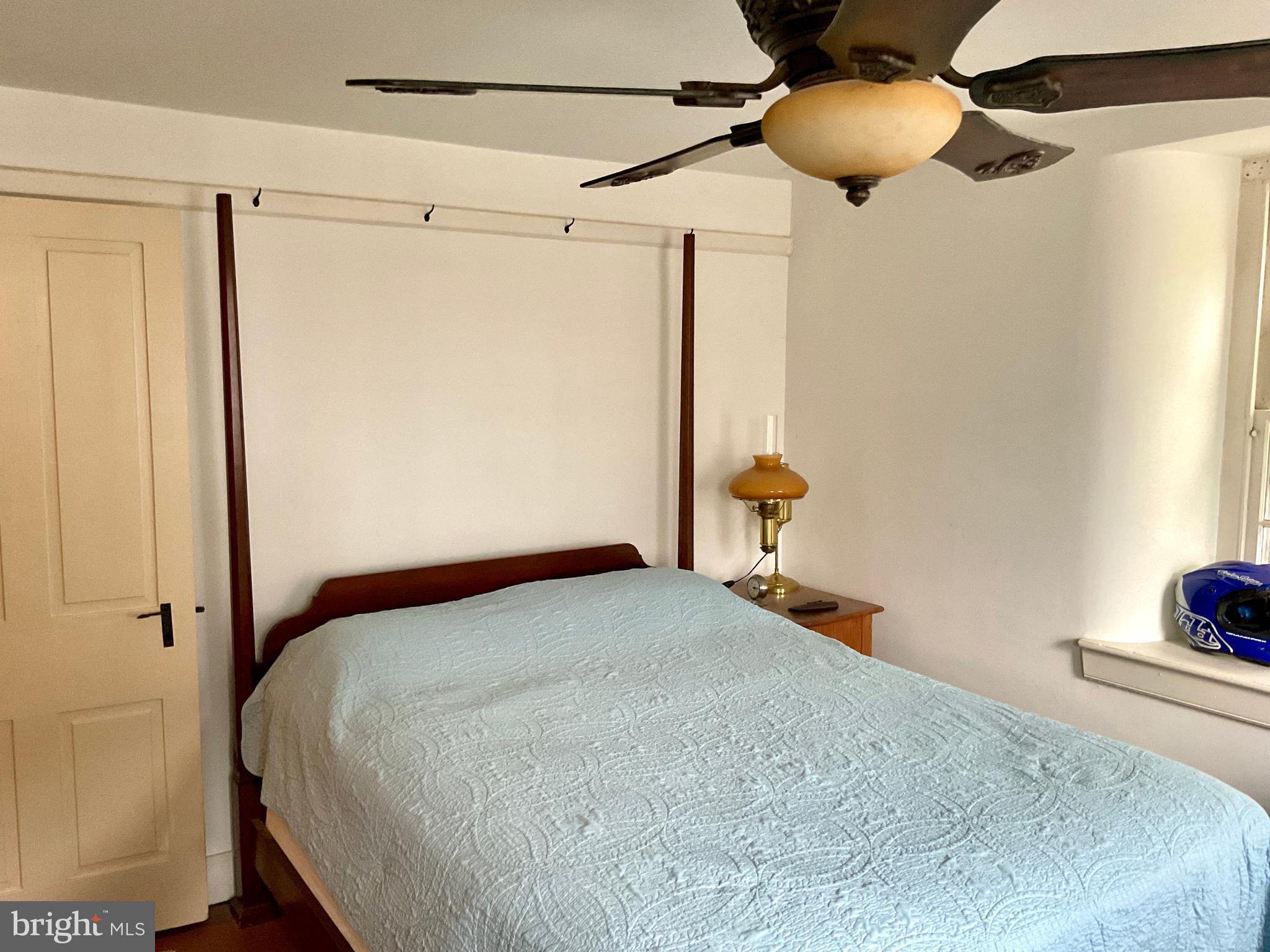 1145 Reading Road Narvon, PA 17555 - Photo 51 of 62 a bedroom with a bed and a chandelier