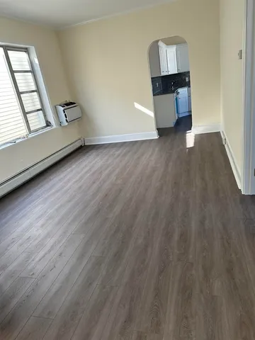 a view of workspace with wooden floor and window