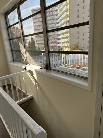 a view of balcony with a small yard