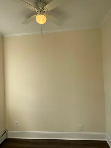 a view of a room with a table and a potted plant