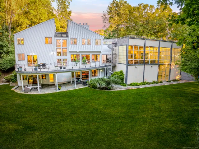a front view of house with yard and outdoor seating