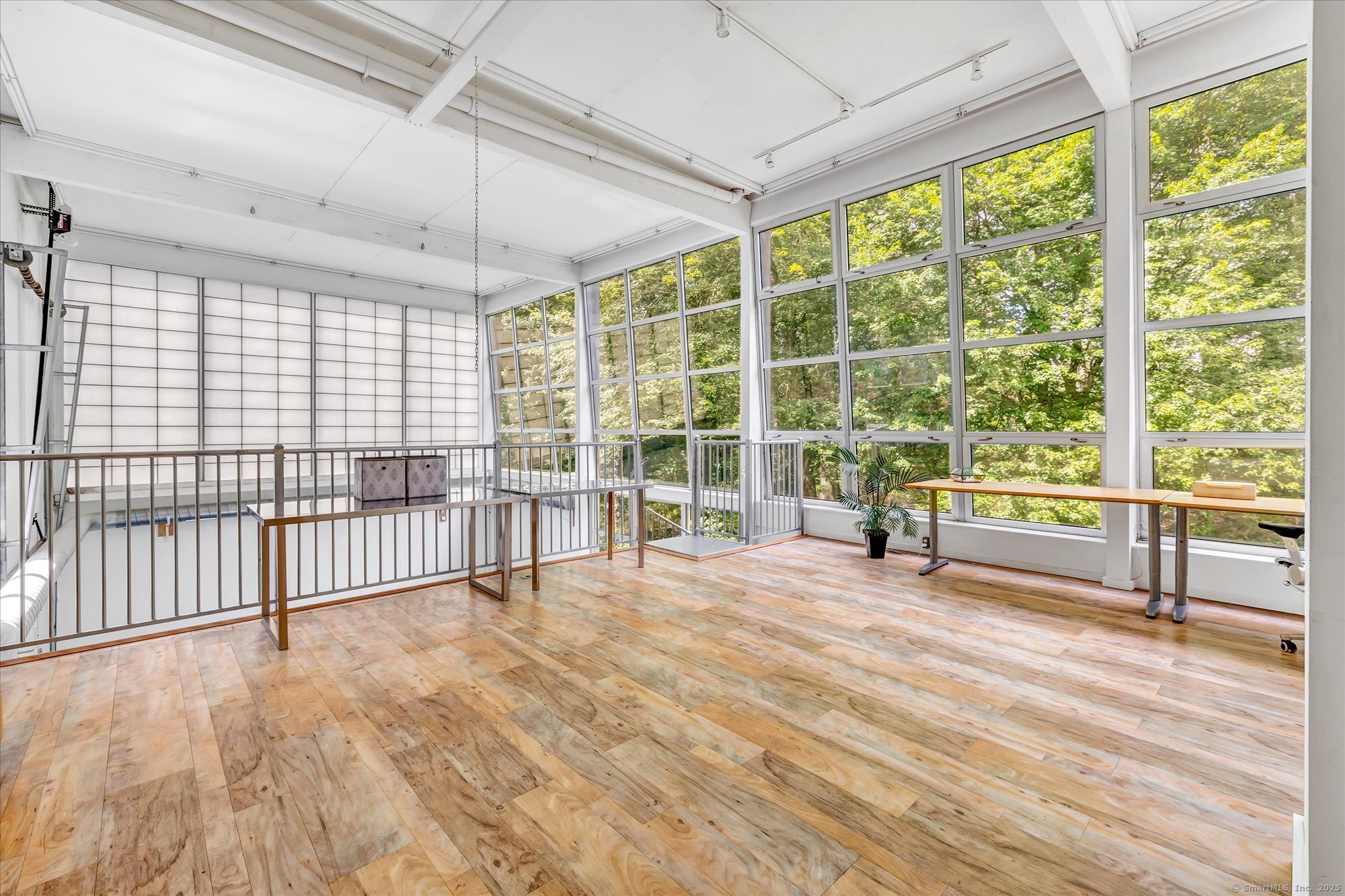 19 A Darbrook Road Westport, CT 06880 - Photo 12 of 40 a view of an empty room with wooden floor and a window