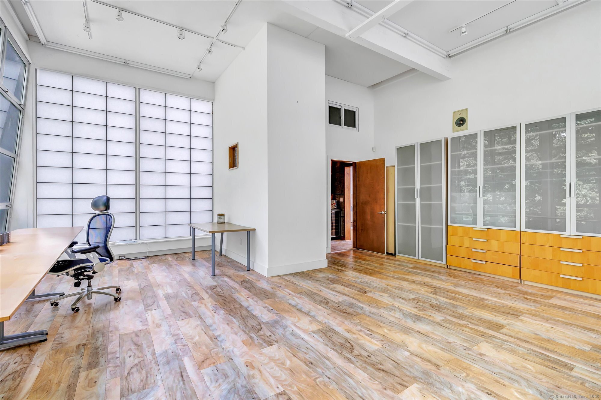 19 A Darbrook Road Westport, CT 06880 - Photo 13 of 40 a view of empty room with wooden floor and windows