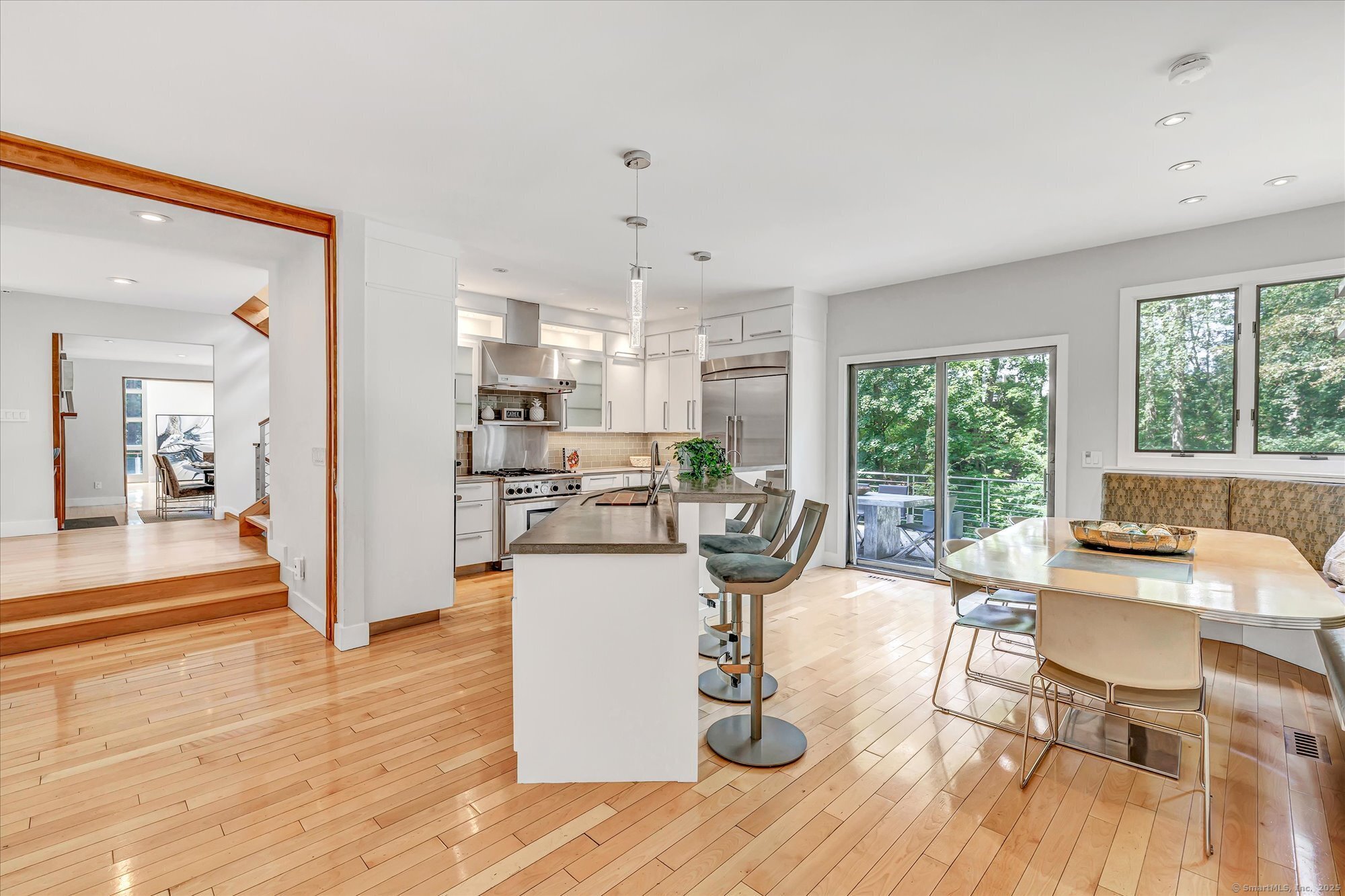 19 A Darbrook Road Westport, CT 06880 - Photo 20 of 40 a view of a dining room with furniture a kitchen and chandelier