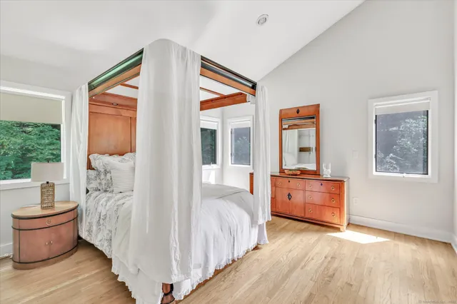 a bedroom with furniture and windows