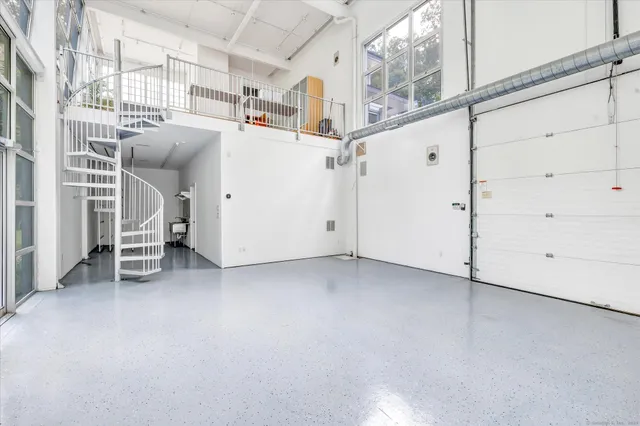 a view of a utility room with racks on the wall