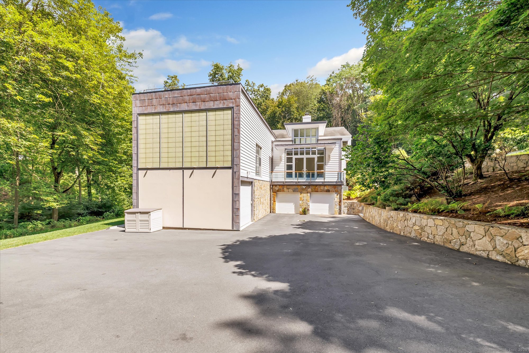 19 A Darbrook Road Westport, CT 06880 - Photo 35 of 40 a view of a house with a yard and potted plants