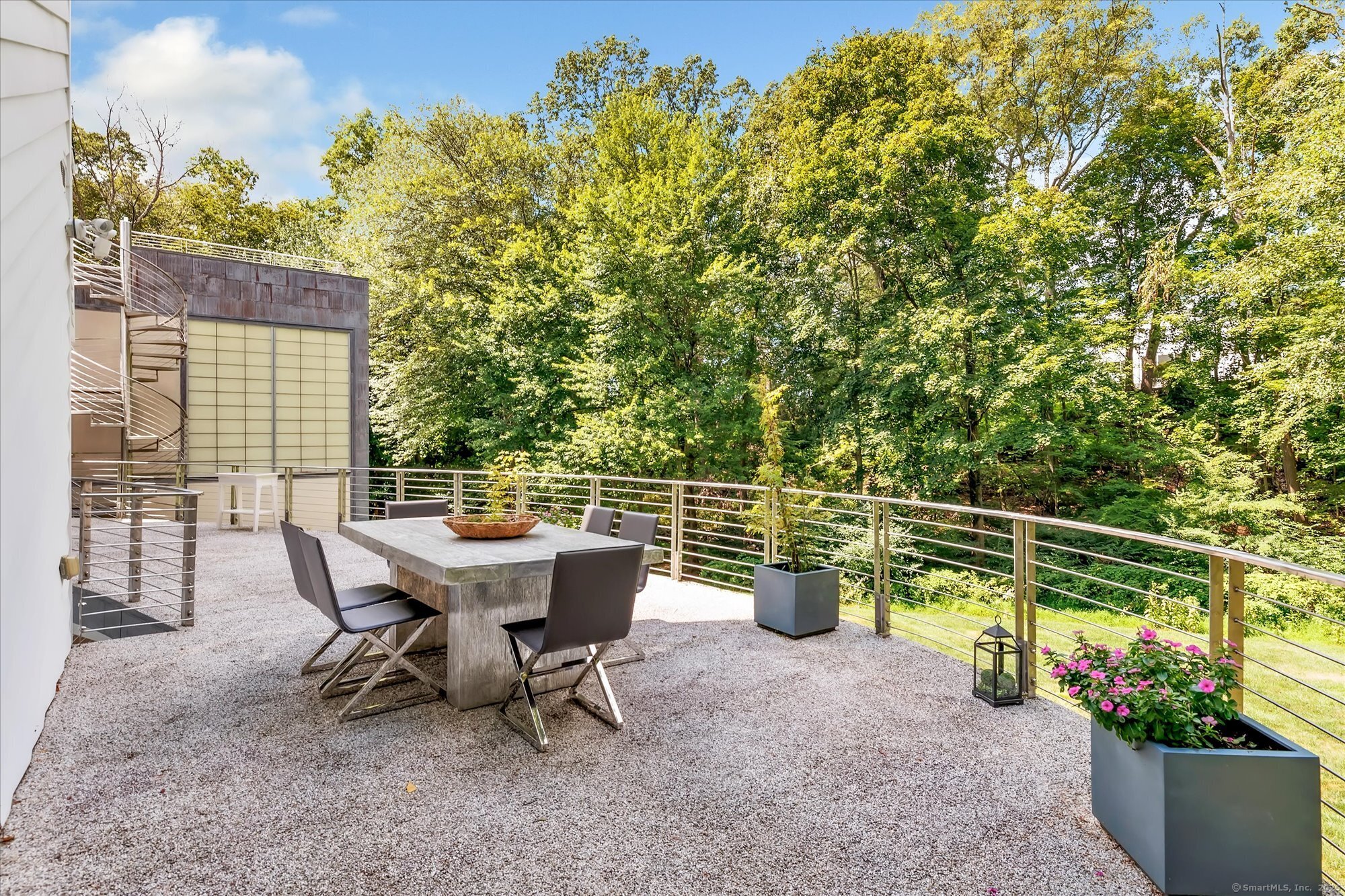 19 A Darbrook Road Westport, CT 06880 - Photo 37 of 40 a view of a chairs and table in the backyard