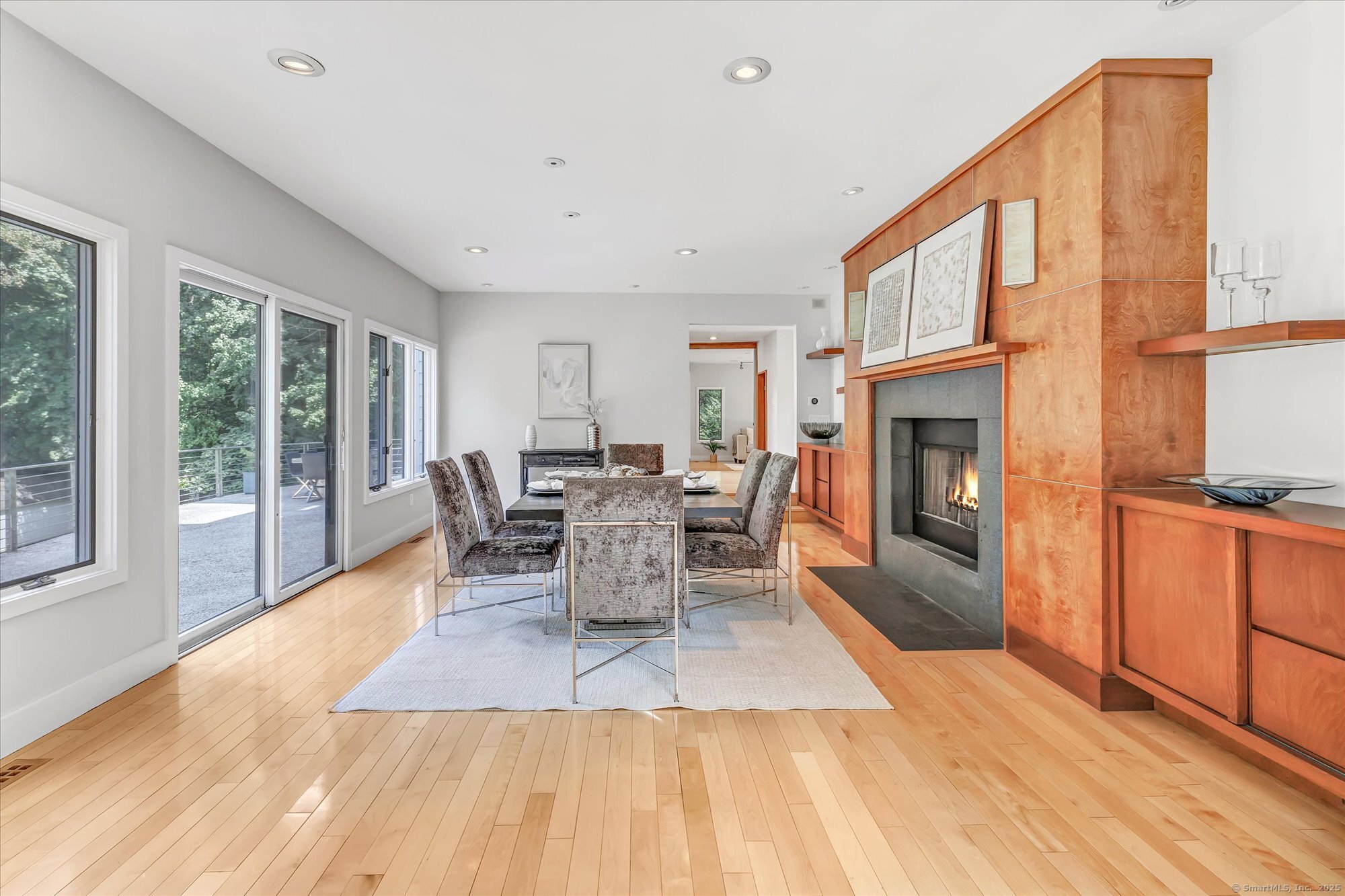 19 A Darbrook Road Westport, CT 06880 - Photo 10 of 40 a dining room with furniture a fireplace and wooden floor