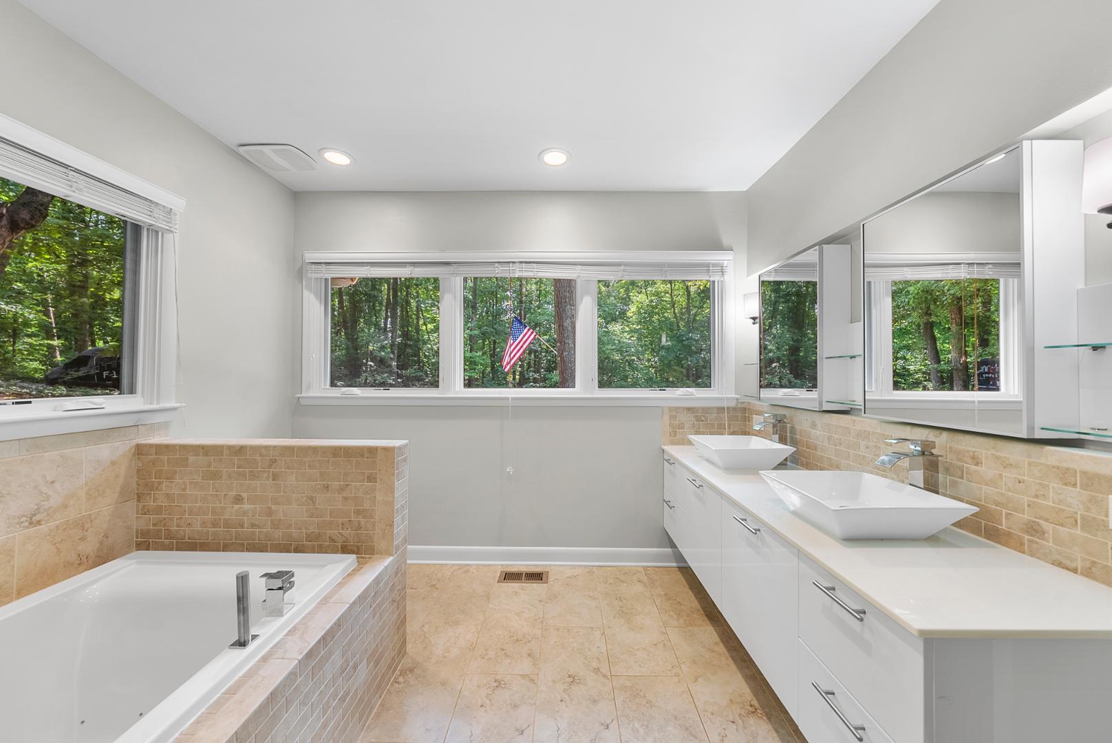 1605 Ridge Road Raleigh, NC 27607 - Photo 22 of 36 a bathroom with a large tub sink and window