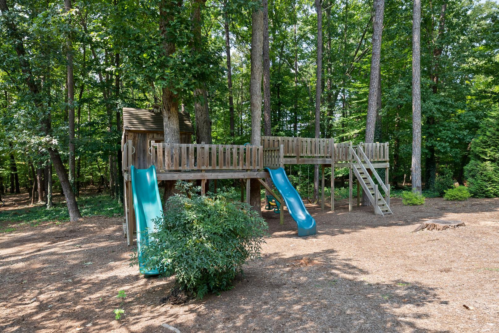 1605 Ridge Road Raleigh, NC 27607 - Photo 31 of 36 a view of a wooden deck with a slide