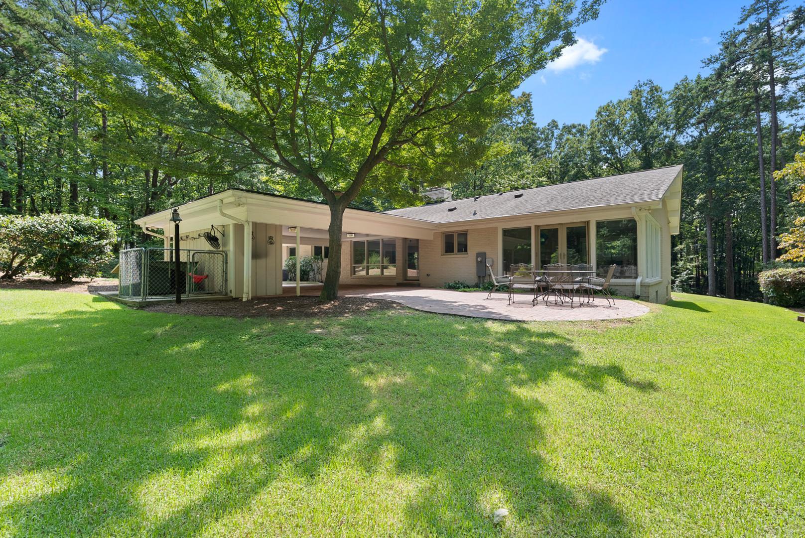 1605 Ridge Road Raleigh, NC 27607 - Photo 33 of 36 a house view with swimming pool and garden
