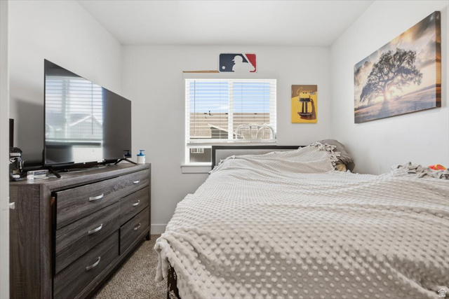 1213 West 1820th Street South Logan, UT 84321 - Photo 14 of 18 Interior room featuring a window with horizontal blinds, light gray wall paint, and carpeted flooring