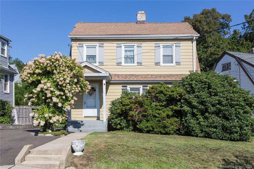 49 Penzance Road Stamford, CT 06902 - Photo 1 of 1 a front view of a house with a yard