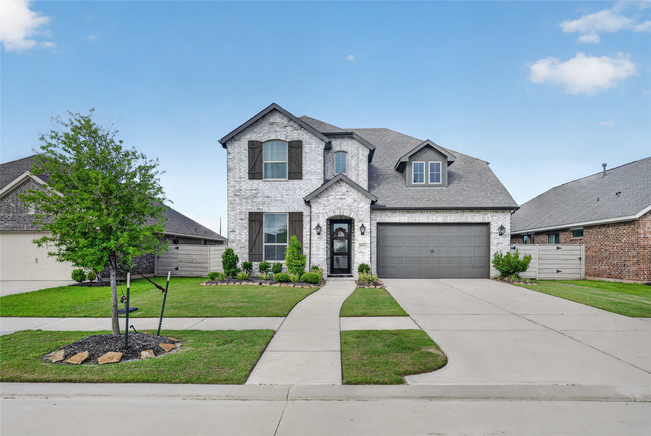 4439 Stone Ridge Lane Manvel, TX 77578 - Photo 1 of 48 a front view of a house with a yard and garage