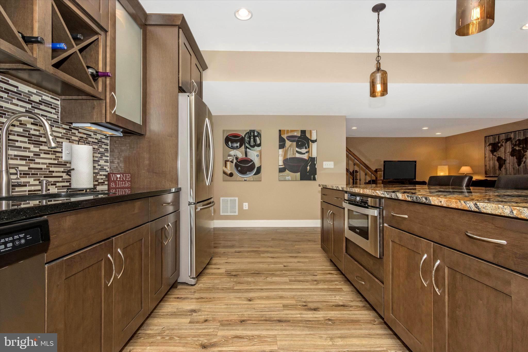 12134 Fulton Ridge Drive Fulton, MD 20759 - Photo 43 of 48 Fantastic mini-kitchen, wet bar and granite island