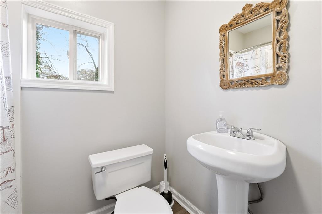 7 Willingham Street Rome, GA 30161 - Photo 17 of 25 a bathroom with a toilet sink and mirror