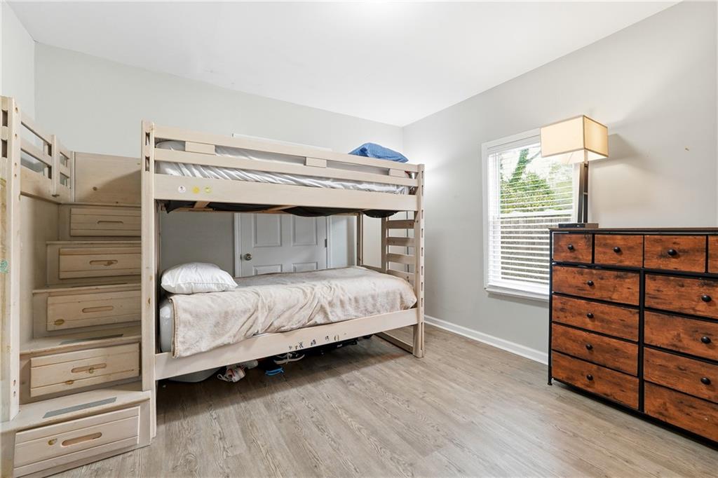 7 Willingham Street Rome, GA 30161 - Photo 18 of 25 a bedroom with a bed and a dresser